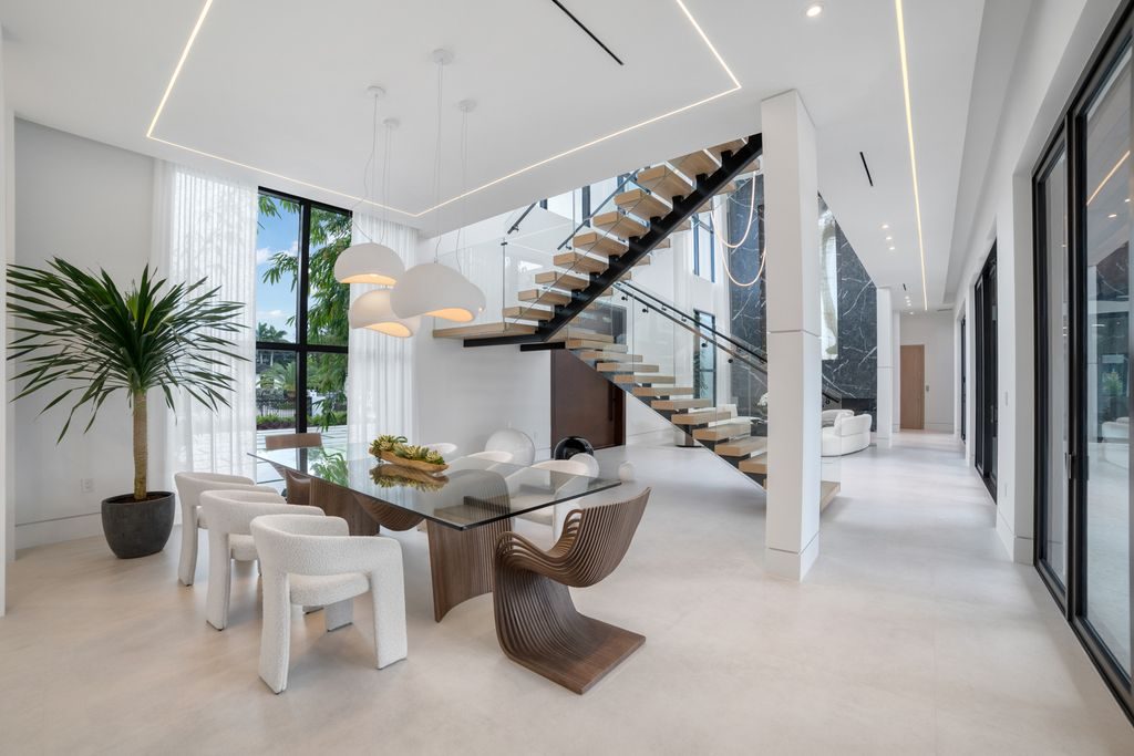 Main living space — 28-foot ceilings and the floating glass staircase